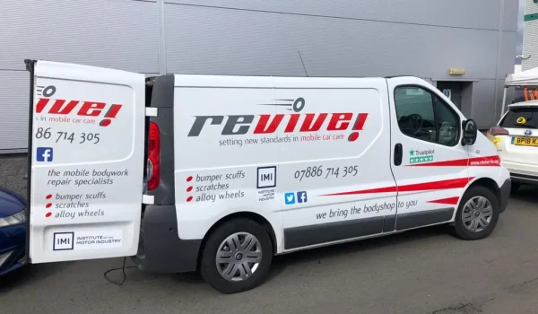 Van graphics including Facebook and Twitter logos